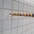 2014 jun 17 yellow taped pipe tiled wall
