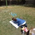 2014 may 01 woman arranging smurf figures park