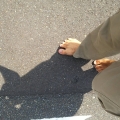 2018 jul 21 bare feet shadow on hot asphalt