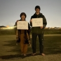 2021 oct 21 two people holding moonlight signs dusk