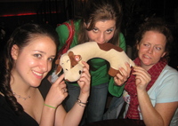 Caitlin, Stacy, and Gemma point, bite, and inspect