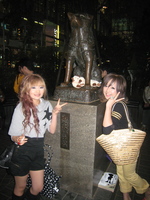 Uncle Cow around Hachiko's paw with two gyaru on either side
