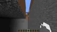 Screenshot in Minecraft showing boundary between flatland a regular terrain