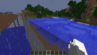 Screenshot in Minecraft showing boundary between flatland a regular terrain