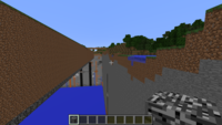 Screenshot in Minecraft showing boundary between flatland a regular terrain