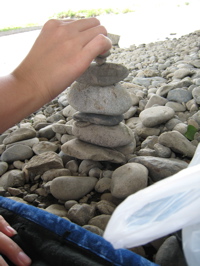 Ami stacking rocks